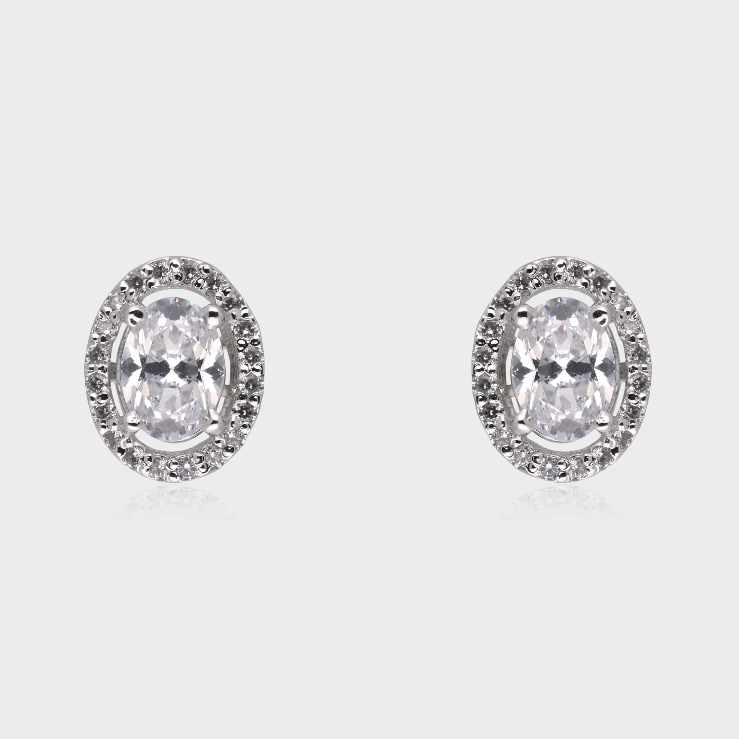 Timeless Radiance: Oval-Cut White Gemstone Halo Stud Earrings in Sterling Silver | SKU : 0003535110, 0021327124, 0021327131