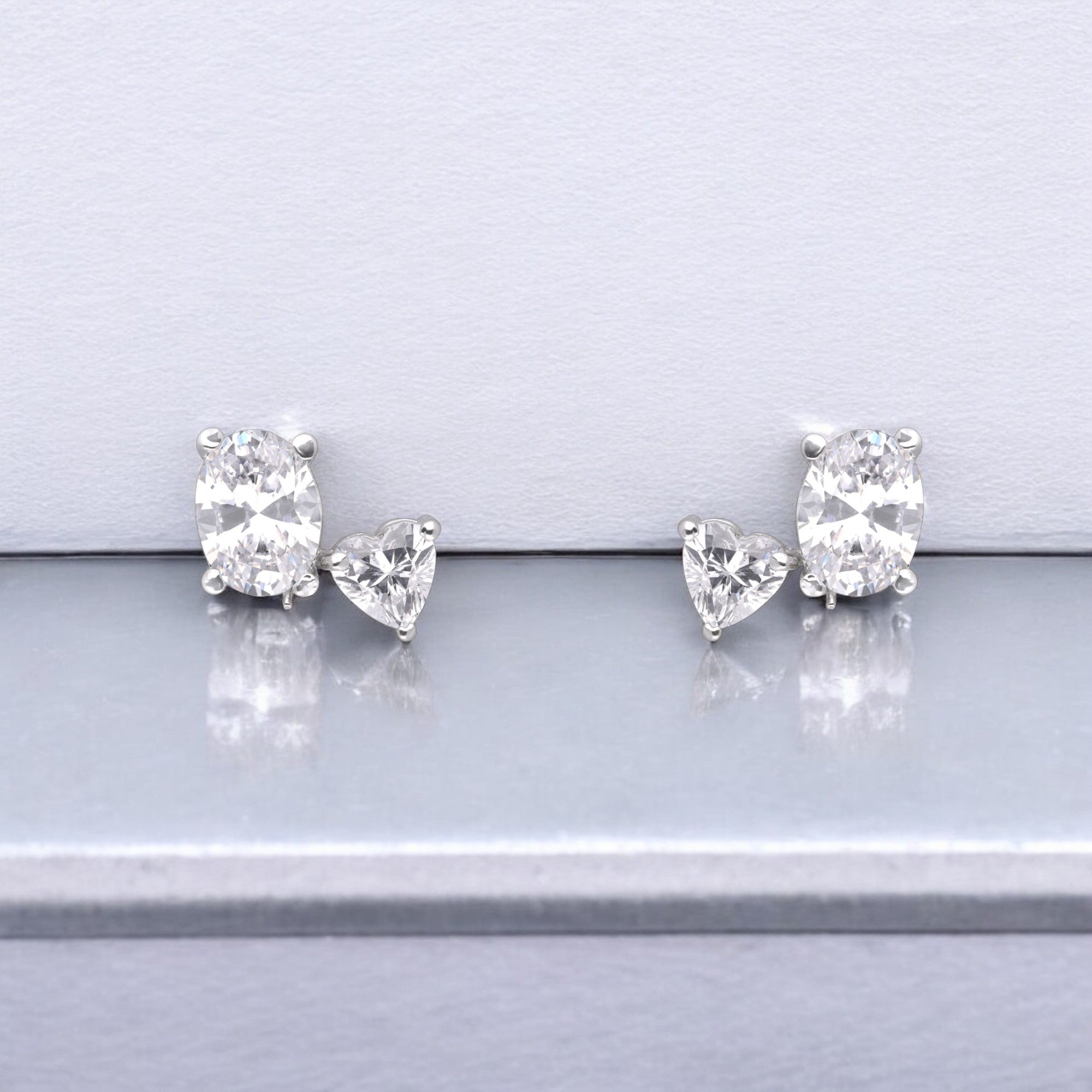 Oval & Heart Cubic Zirconia Mismatched Silver Stud Earrings | SKU : 0003535202, 0021327308, 0021327315