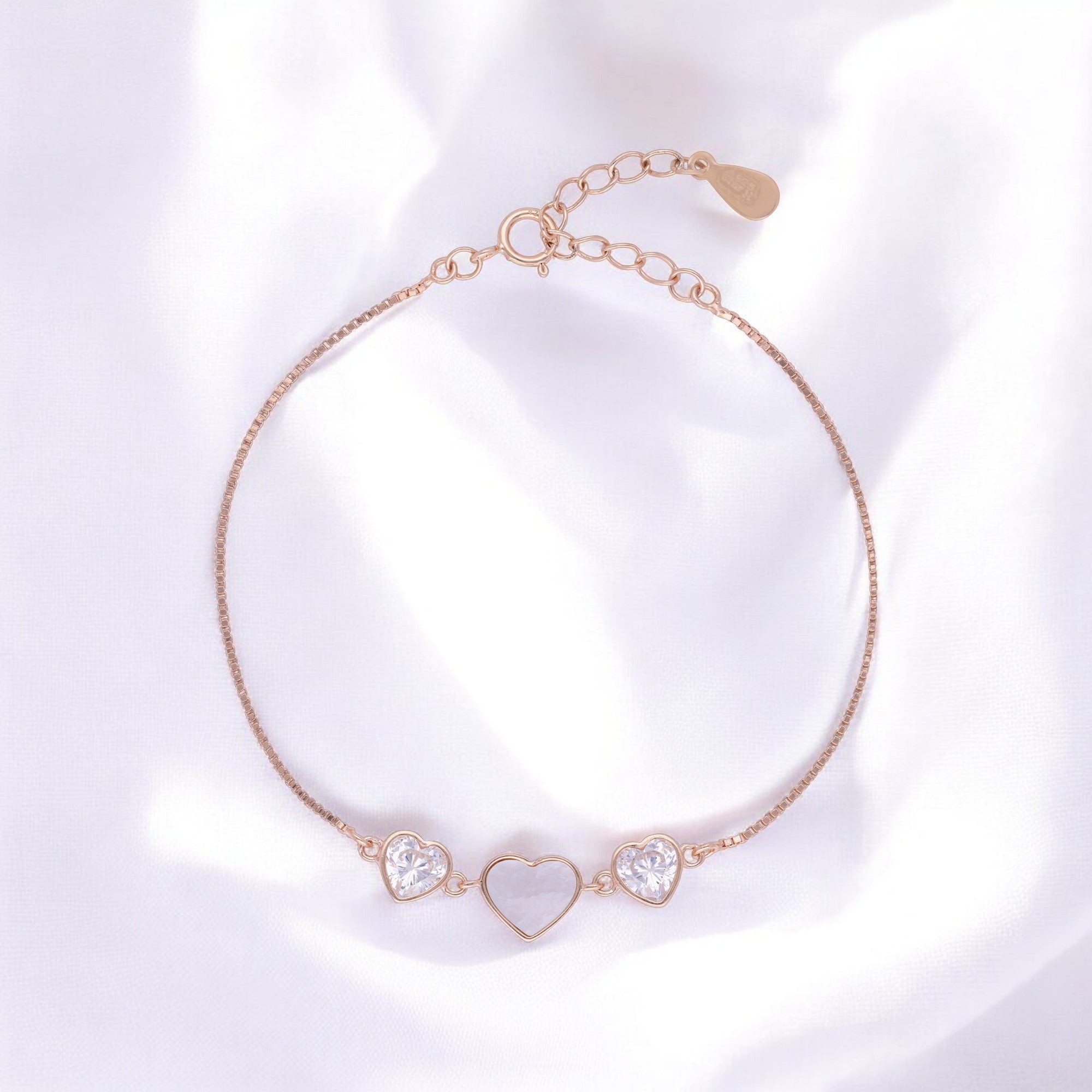 Rose-Toned Triple Heart Bracelet with Mother-of-Pearl and Sparkling Stone Accents | SKU : 0003624234, 0021525322, 0021525339, 0021525346, 0021525315