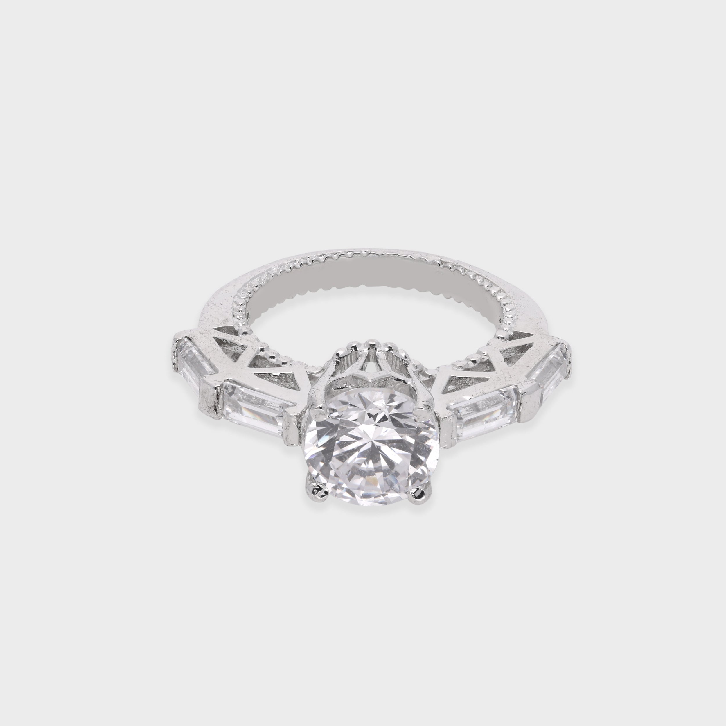 Elegant Round-Cut Solitaire Ring with Baguette Accents | SKU : 0021423321