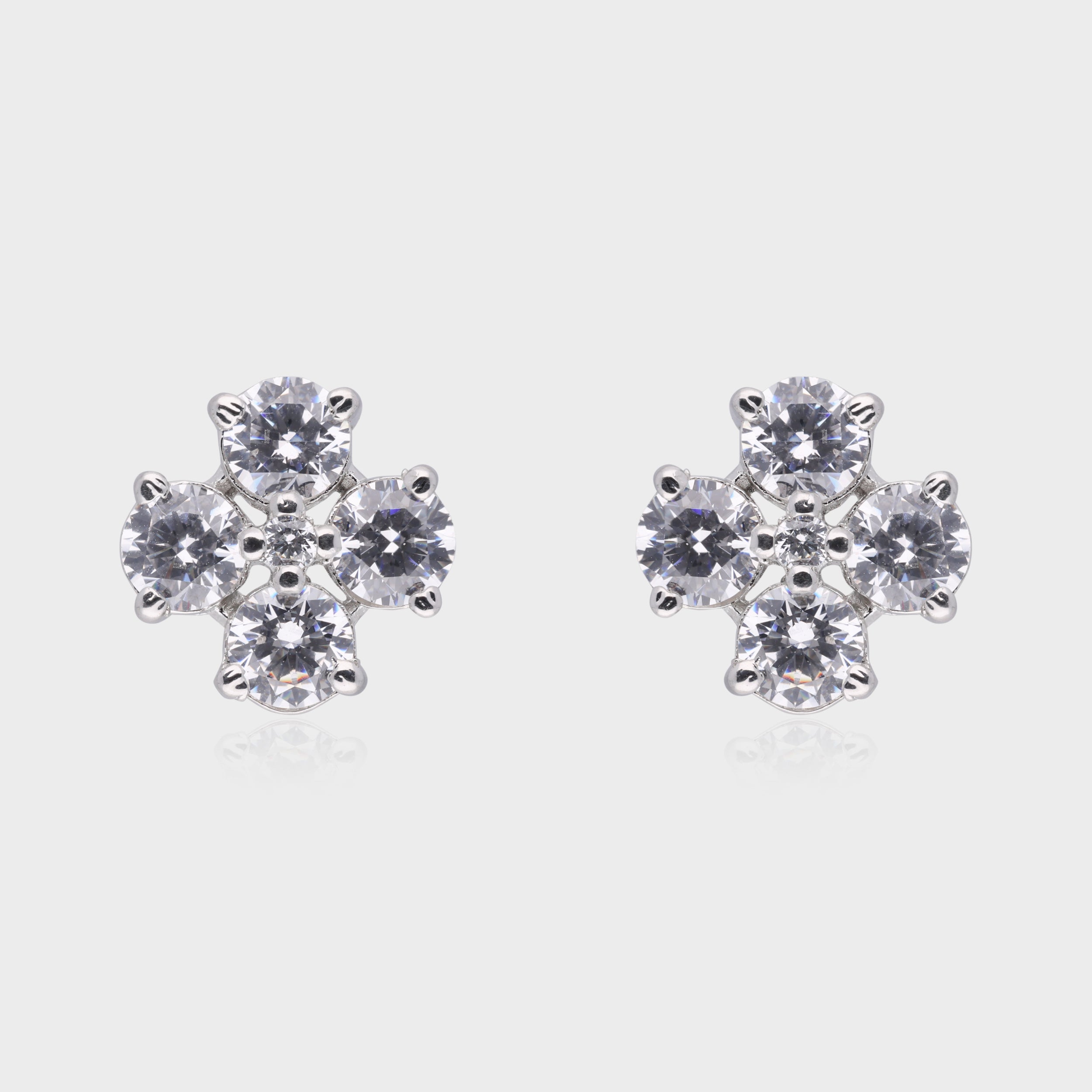 Radiant Bloom: Round-Cut White Gemstone Floral Stud Earrings in Sterling Silver | SKU : 0003534991, 0021326769, 0021326776