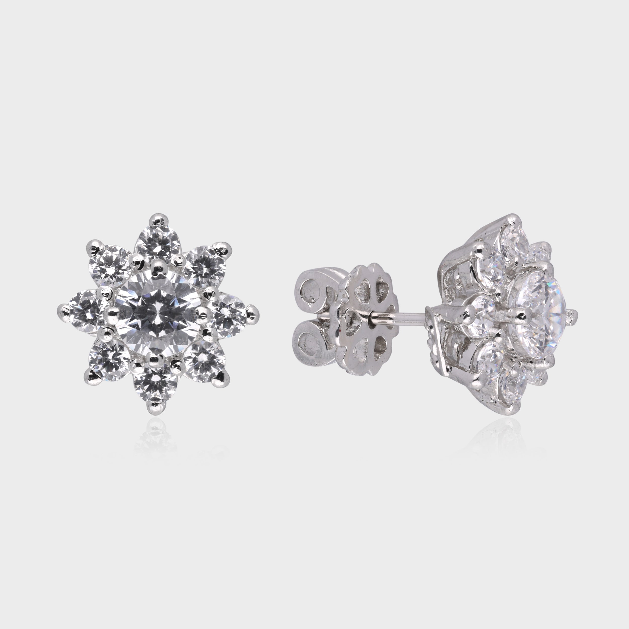 Luminous Bloom: Round-Cut White Gemstone Floral Stud Earrings in Sterling Silver | SKU : 0003535059, 0021326998, 0021327001, 0021327513, 0021327520