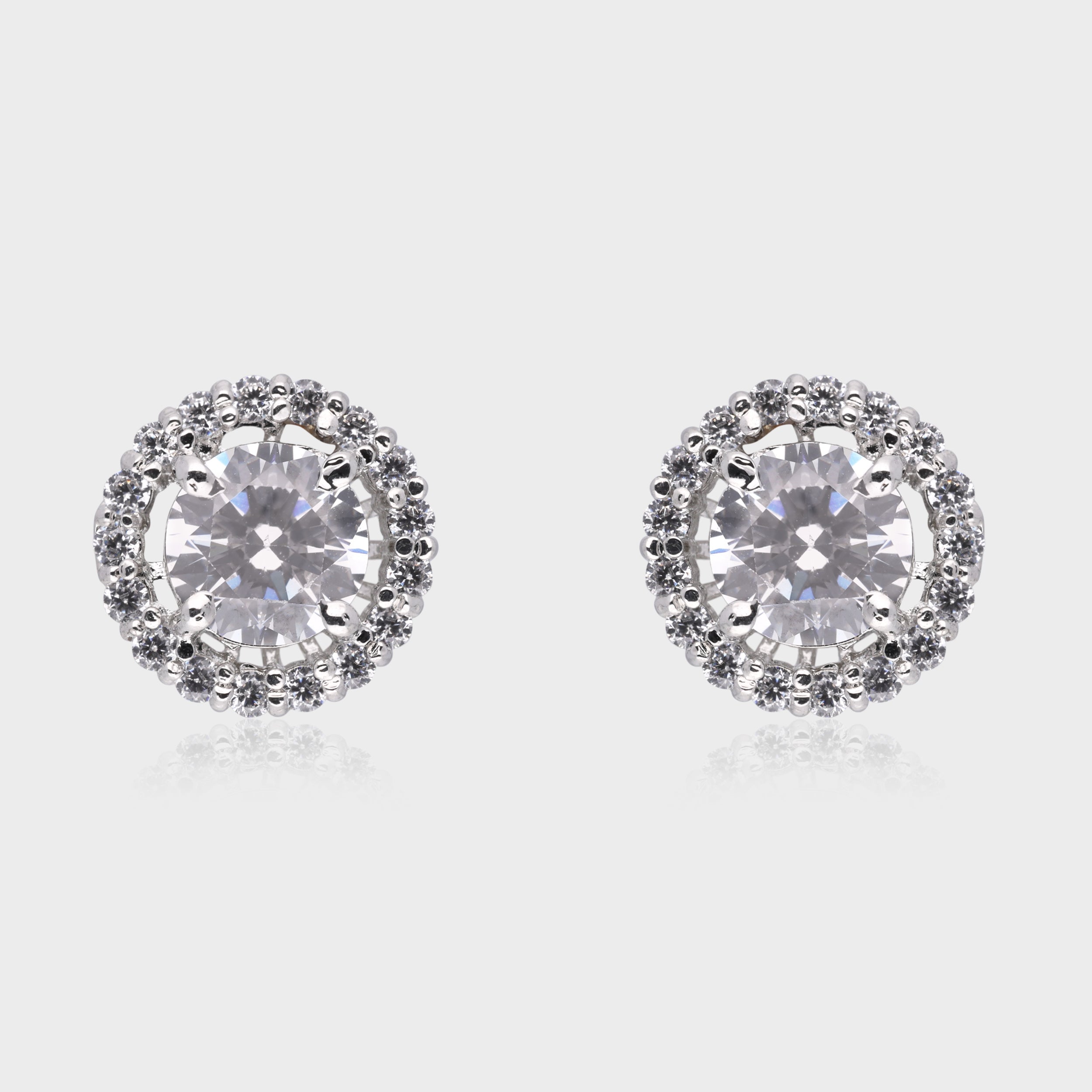 Radiant Majesty: Round-Cut White Gemstone Double Halo Stud Earrings in Sterling Silver | SKU : 0003535073, 0021327032, 0021327049