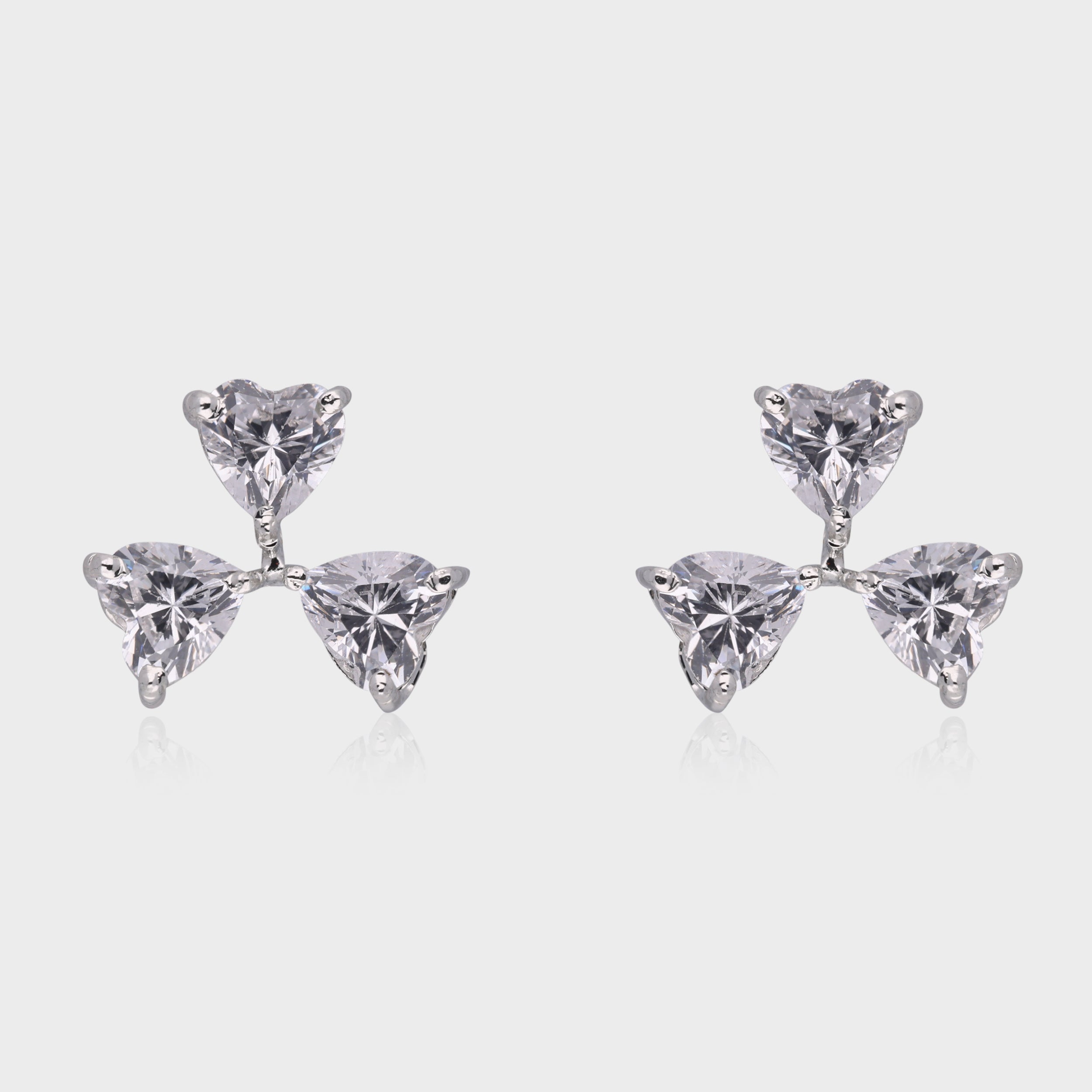 Trilliant Bloom: Heart-Cut White Gemstone Cluster Stud Earrings in Sterling Silver | SKU : 0003535141, 0021327186, 0021327193