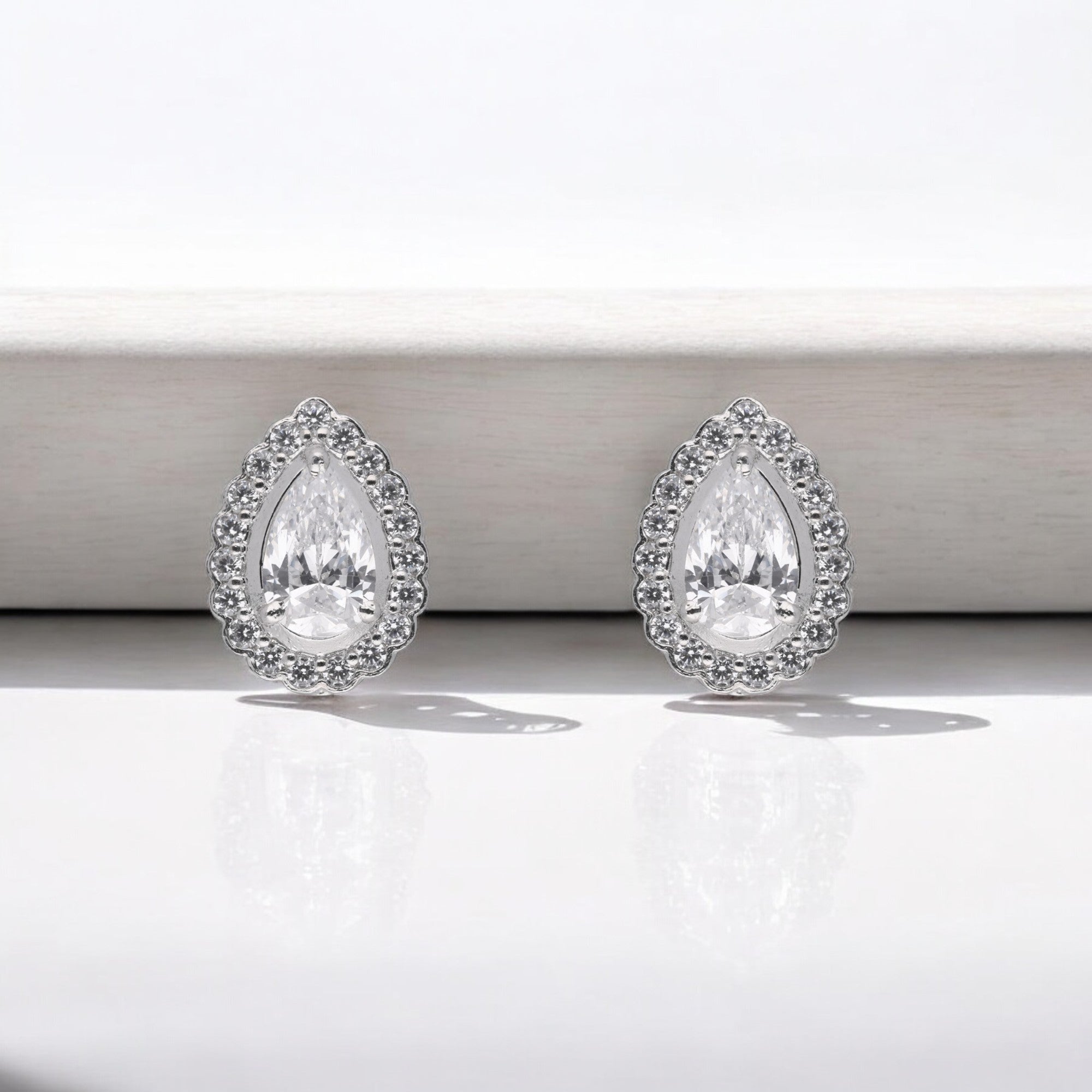 Timeless Pear-Cut Halo Stud Earrings – Elegant & Radiant | SKU : 0003535172, 0021327247, 0021327254