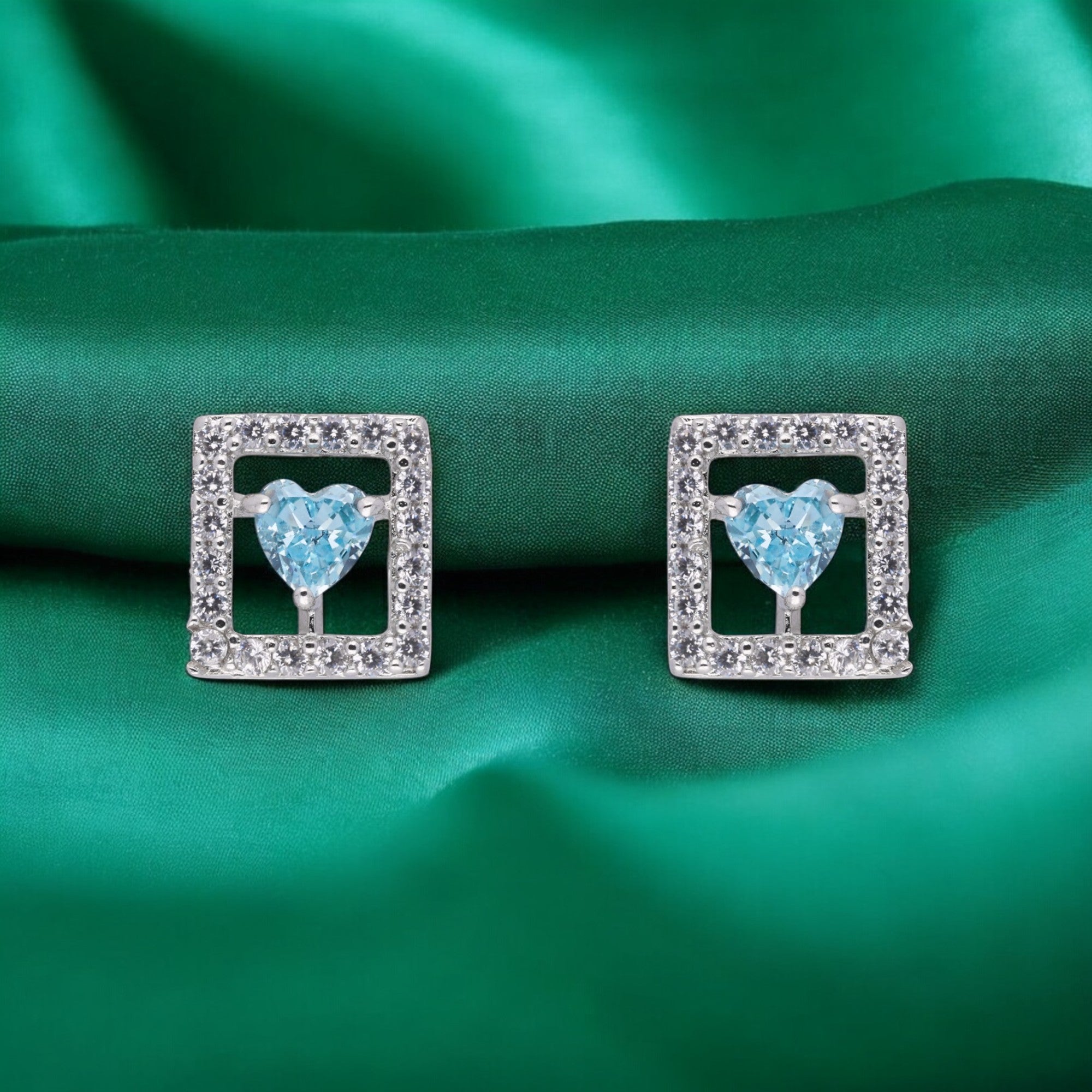 Radiant Blue Heart Stud Earrings in a Square Frame | SKU : 0003594315, 0021456008, 0021455988, 0021455995