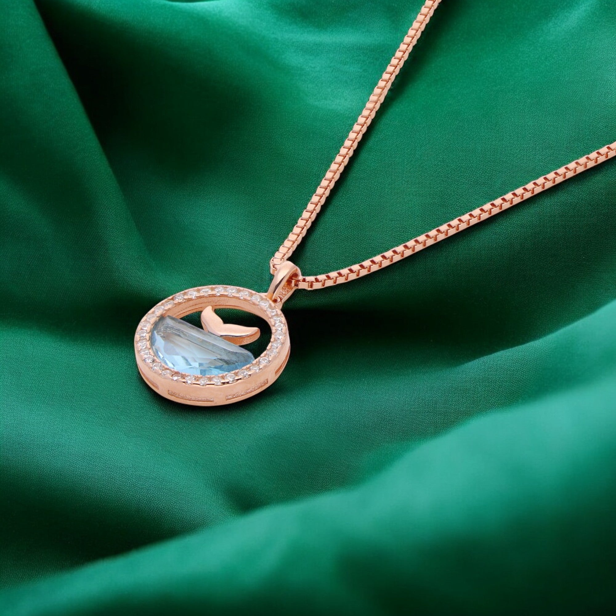 Ocean’s Embrace Pendant Necklace in Rose Gold & Silver with Aquatic Blue Gem | SKU : 0021142697, 0021142727, 0021142703, 0021142710, 0021142673, 0021142680, 0021142871, 0003523568, 0003523544