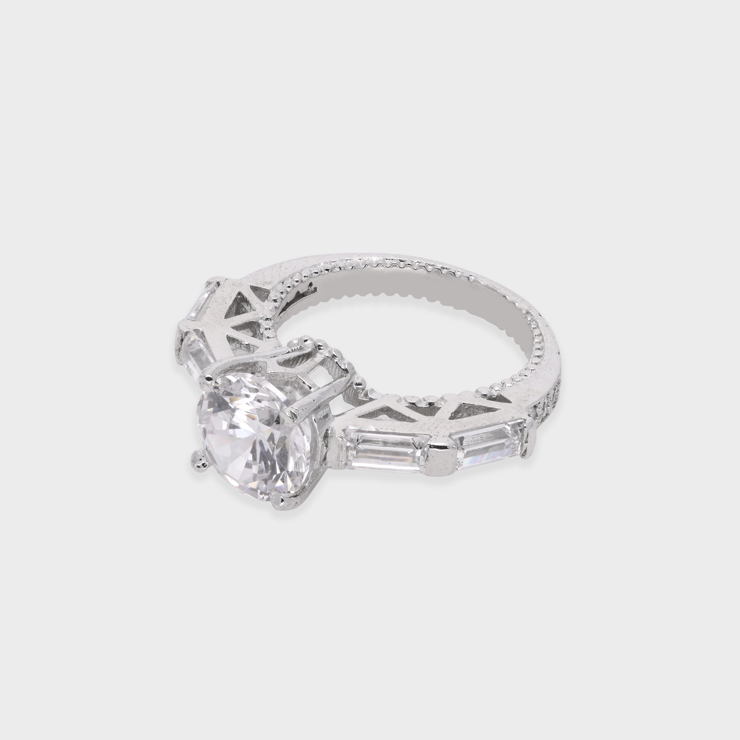 Elegant Round-Cut Solitaire Ring with Baguette Accents | SKU : 0021423321