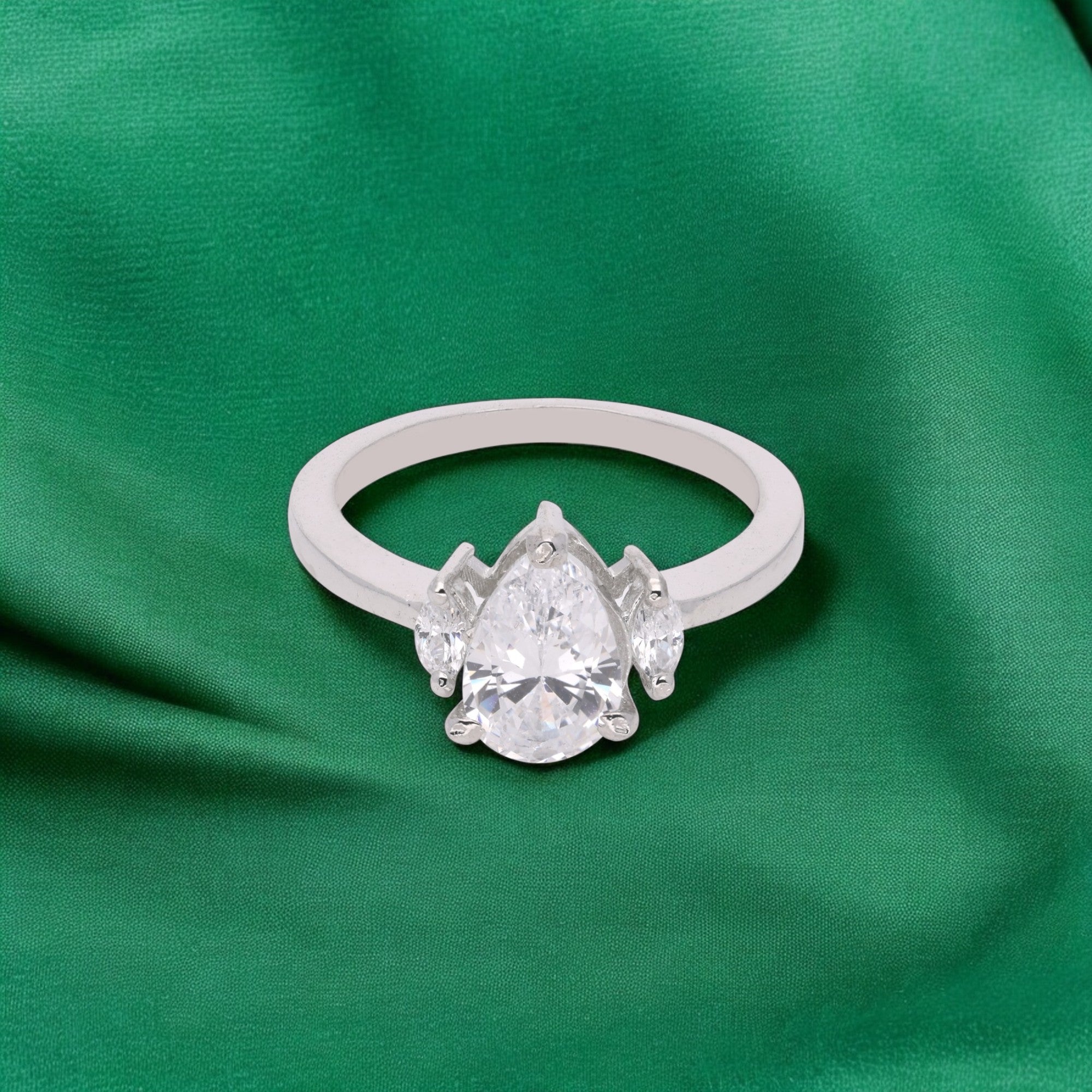 Elegant Pear-Cut Solitaire Ring with Marquise Side Stones | SKU : 0021423390
