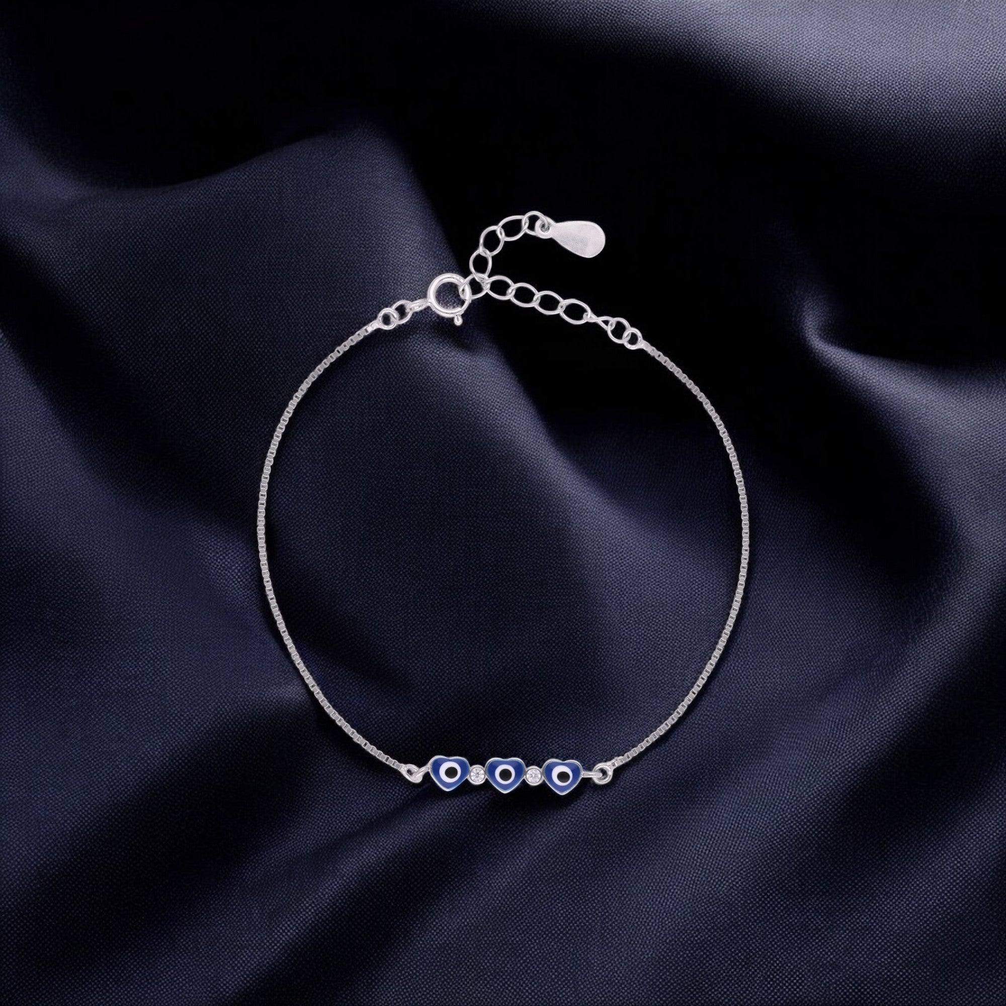 Silver Tone Heart Evil Eye Bracelet with Blue Enamel Accents | SKU : 0021525551, 0021525544, 0021525537, 0021525520, 0003624197, 0021546204, 0021546198, 0021546211, 0021546228
