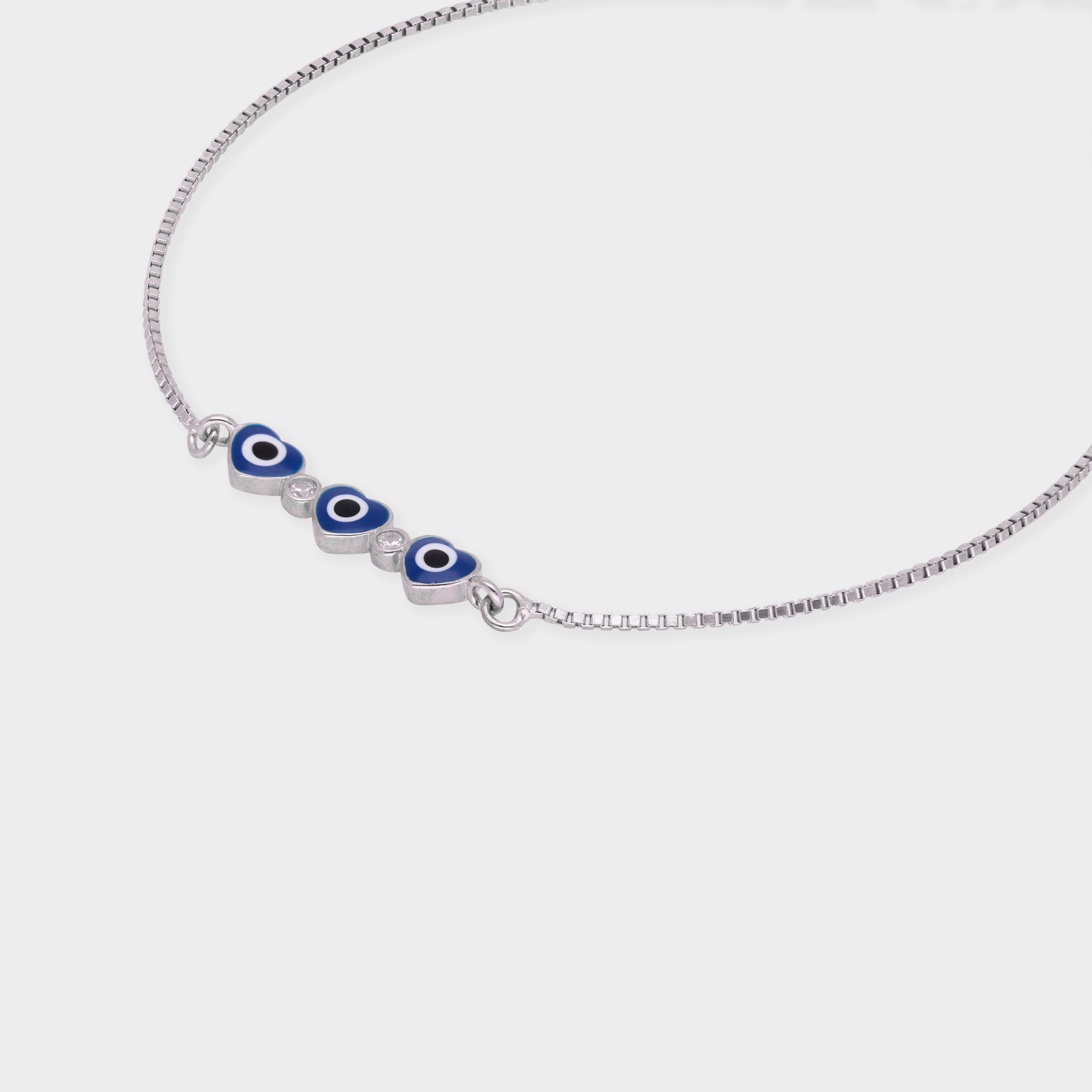 Silver Tone Heart Evil Eye Bracelet with Blue Enamel Accents | SKU : 0021525551, 0021525544, 0021525537, 0021525520, 0003624197, 0021546204, 0021546198, 0021546211, 0021546228