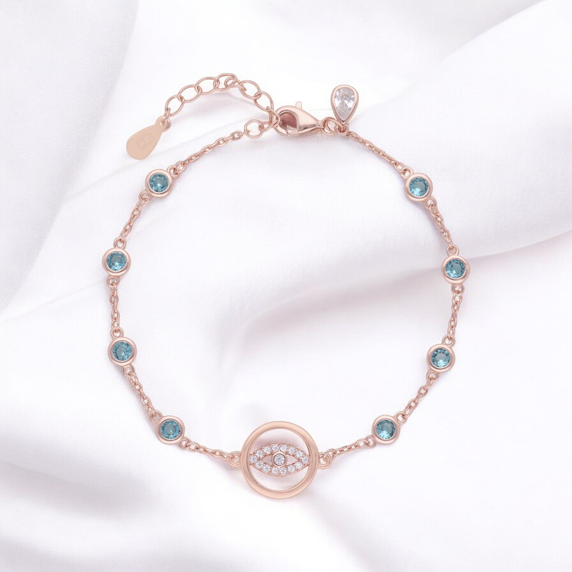 Dazzling Evil Eye Bracelet with Blue Crystal Stations in Silver and Rose Finish | SKU : 0021546044, 0021546051, 0021546068, 0021546037