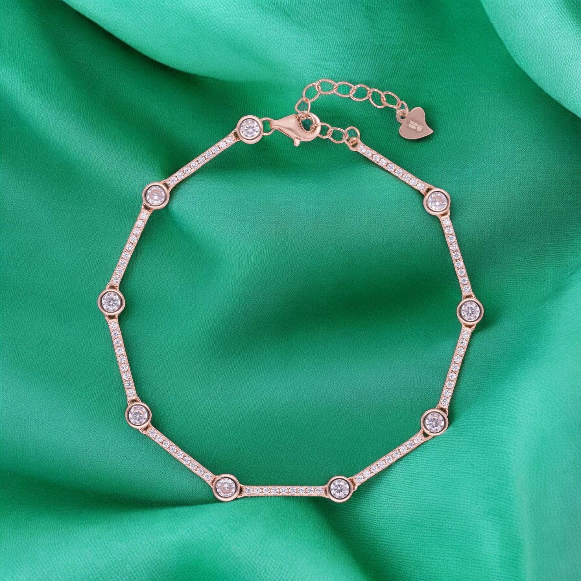 Rose-Toned Tennis-Style Bracelet with Bezel-Set Sparkling Stones and Pavé Link Detailing | SKU : 0003630945, 0021546532