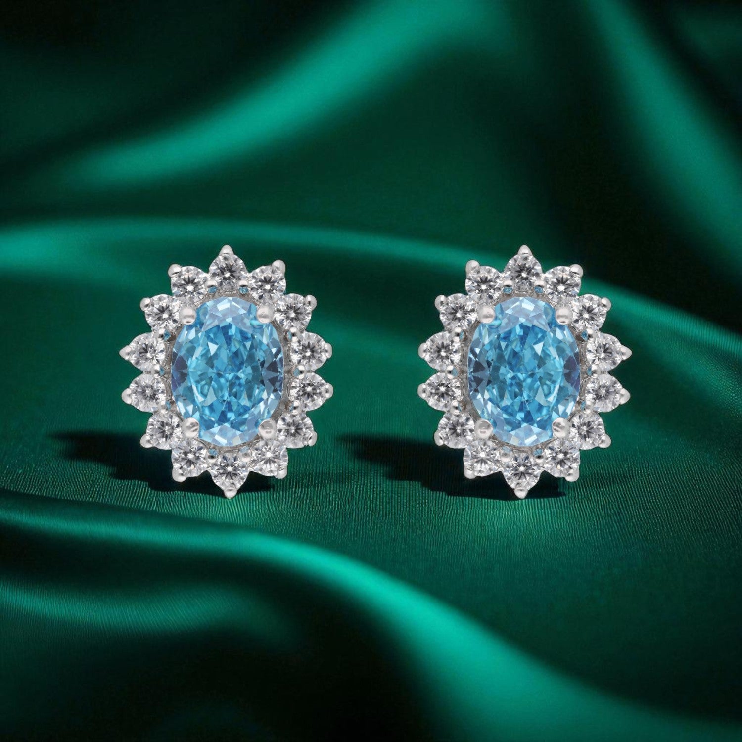 Elegant Sterling Silver Blue Topaz & Halo CZ Stud Earrings | SKU : 0022158642