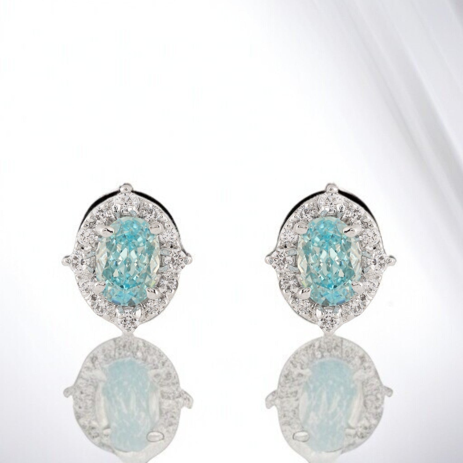 Sterling Silver Blue Oval Halo Stud Earrings | SKU : 0022158895