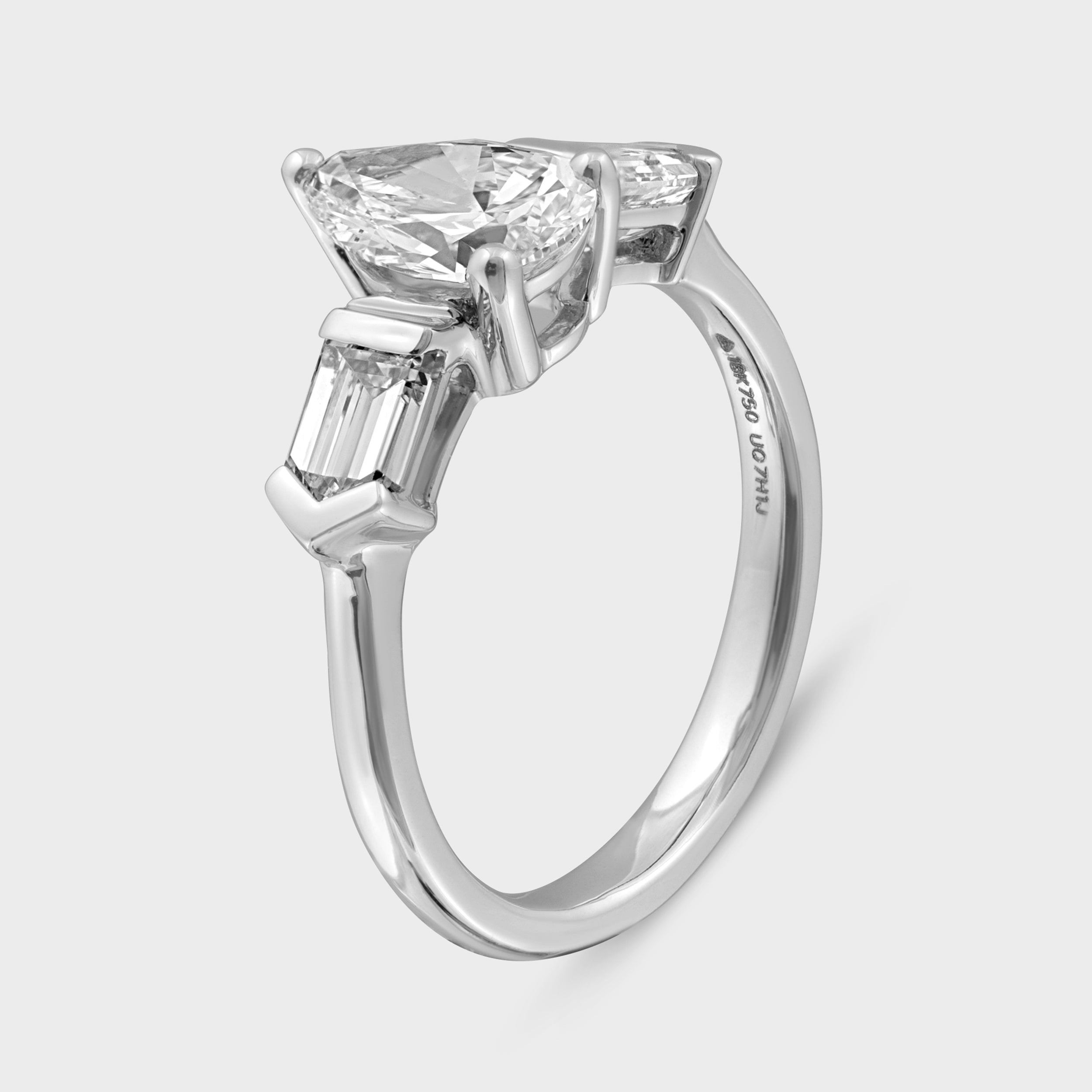 Elegance Personified: Lab Grown Solitaire Pear Diamond Ring with Baguette Cut Accents in White Gold | SKU : 0019512297