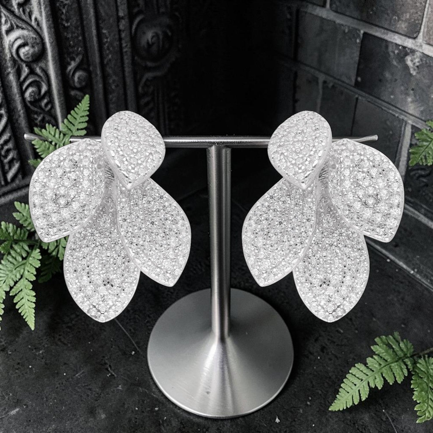 Sterling silver layered leaf earrings with cubic zirconia and polished finish | SKU: 0006705527