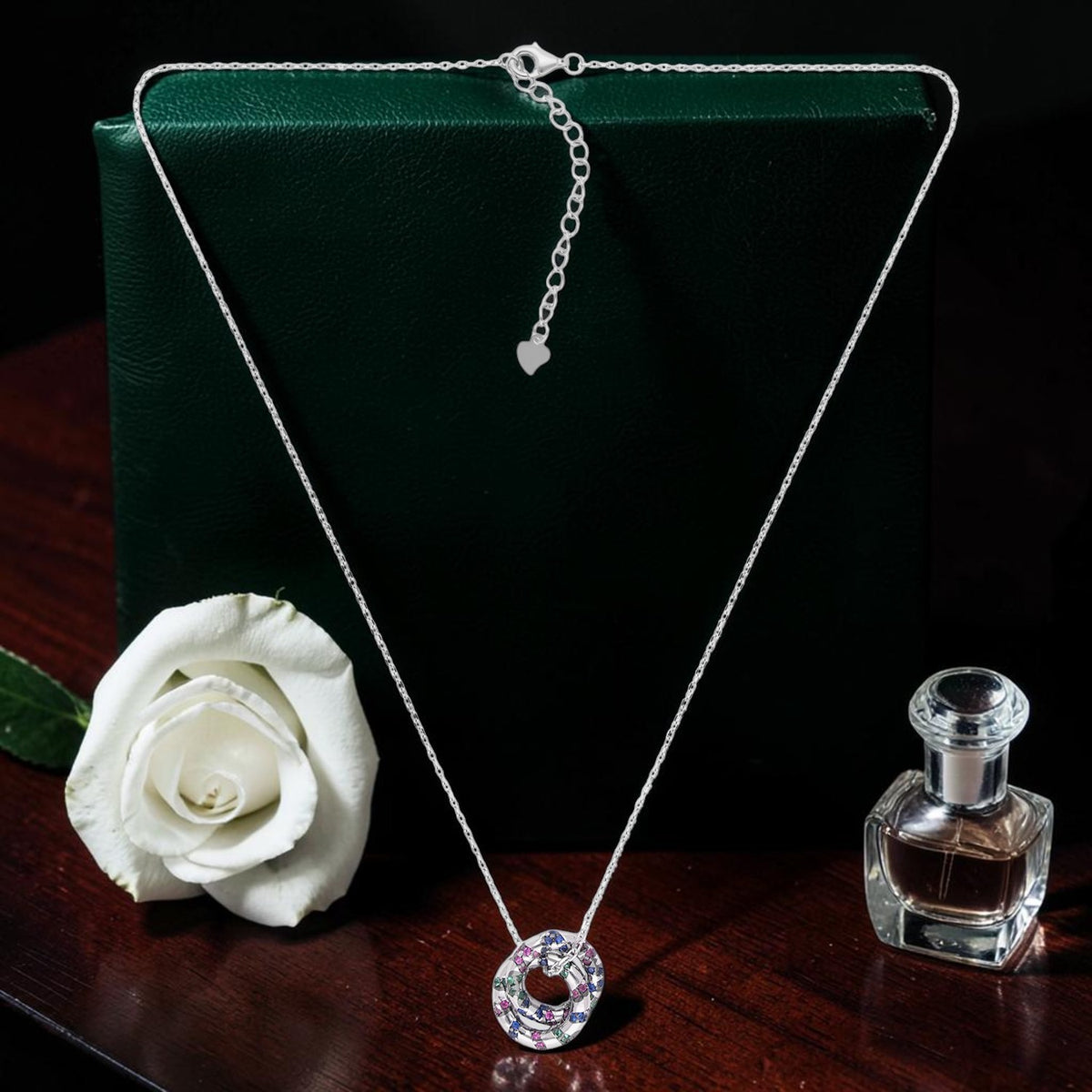 Sterling silver circular pendant necklace with multicolour cubic zirconia detailing | SKU: 0006709389